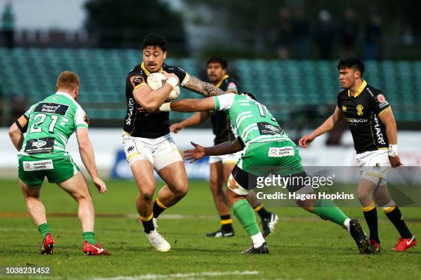 Ben Lam of Wellington fends Sam Slade of Manawatu during the round six Mitre 10 Cup match between Manawatu and Wellington at Central Energy Trust...