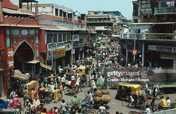 intersection in old delhi. - delhi street stock pictures, royalty-free photos & images