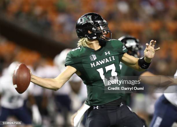 Cole McDonald of the Hawaii Rainbow Warriors fires a pass downfield during the third quarter of the game against the Duquesne Dukes at Aloha Stadium...