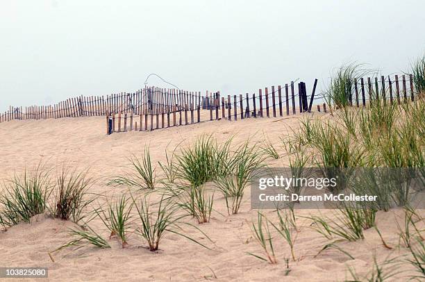 Sand dunes and fences are seen along Chatham Beach September 3, 2010 in Chatham, Massachusetts. Hurricane Earl has been downgraded to a category 1...