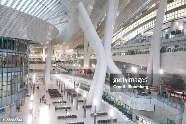 Passengers walk through the departure concourse inside West Kowloon Station, which houses the terminal for the Guangzhou-Shenzhen-Hong Kong Express...