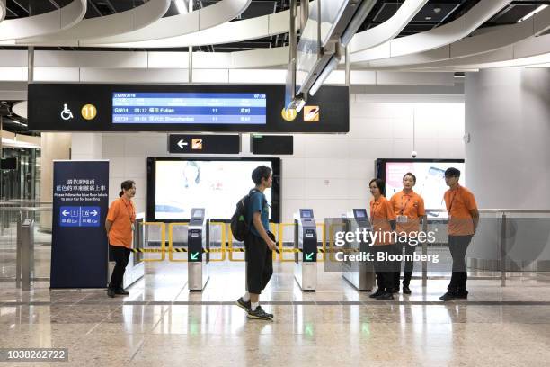 Passenger walks past ticket gates in the Mainland Port Area at West Kowloon Station, which houses the terminal for the Guangzhou-Shenzhen-Hong Kong...