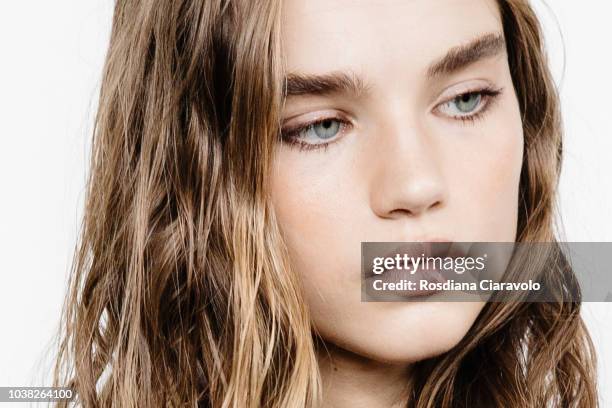Model Meghan Roche , make up detail, is seen backstage ahead of the Philosophy Di Lorenzo Serafini show during Milan Fashion Week Spring/Summer 2019...