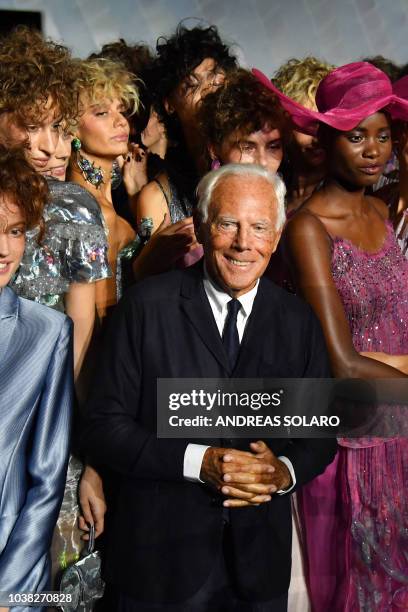 Italian fashion designer Giorgio Armani and models acknowledge applause following the presentation of the Armani fashion show, as part of the Women's...