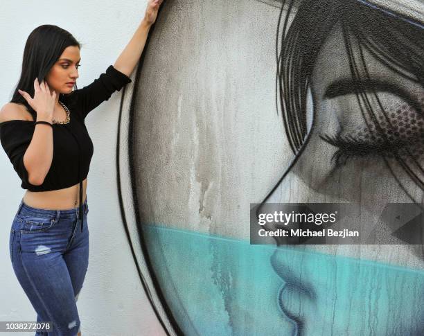 Laci Kay poses for portrait with mural by Hans Haveron at Vocal Social Giveback at TAP The Artists Project on September 22, 2018 in Los Angeles,...