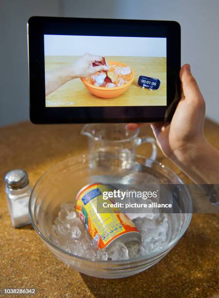 Woman watches a video tutorial on a tablet computer in Hanover, Germany, 15 September 2014. 'Life hacking' is a trend with bloggers giving daily life...