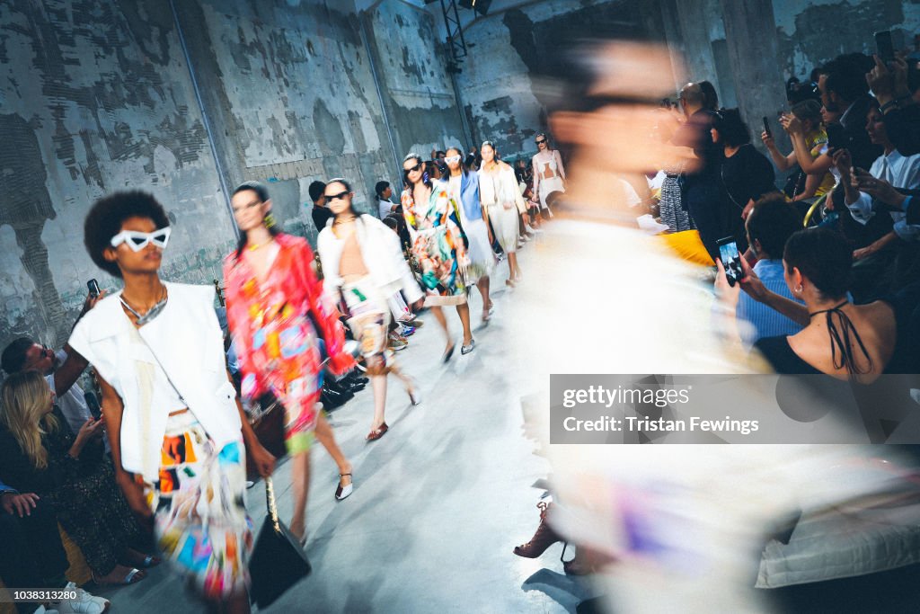Models walk the runway at the Marni show during Milan Fashion Week