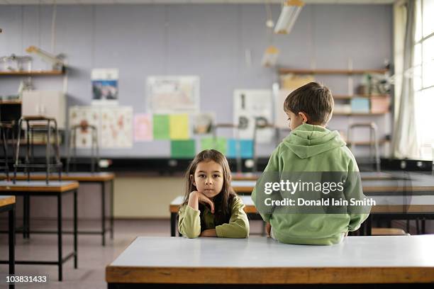 brother watches sister - new zealand schools stock pictures, royalty-free photos & images