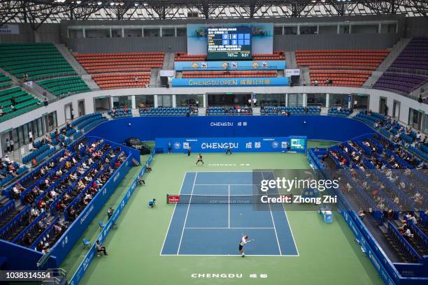 Ruben Bemelmans of Belgium serves against Felix Auger-Aliassime of Canada during 2018 ATP Chengdu Open Singles Qualifying at Sichuan International...