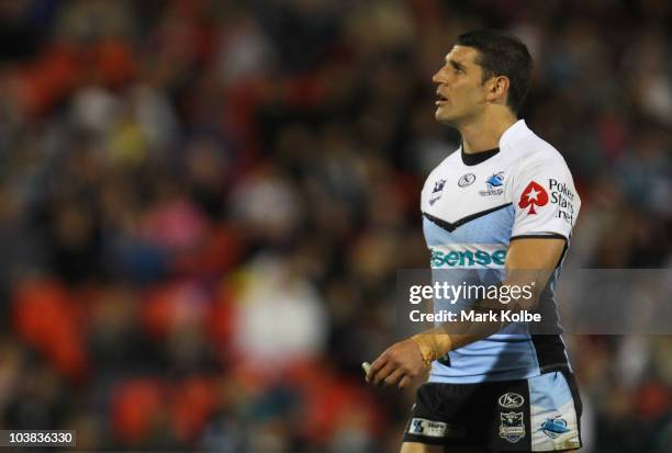 Trent Barrett of the Sharks looks dejected as he watches the big screen during the round 26 NRL match between the Penrith Panthers and the Cronulla...