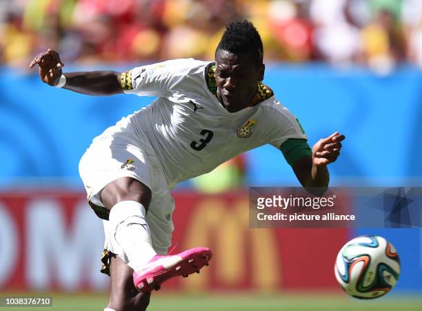 Asamoah Gyan of Ghana in action during the FIFA World Cup 2014 group G preliminary round match between Portugal and Ghana at the Estadio National...