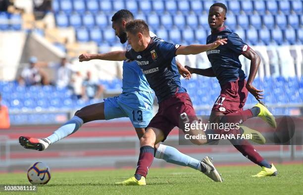 Lazio's Brazilian defender Wallace vies for the ball with Genoa's Polish forward Krzystof Piatek during the Italian Serie A football match between SS...