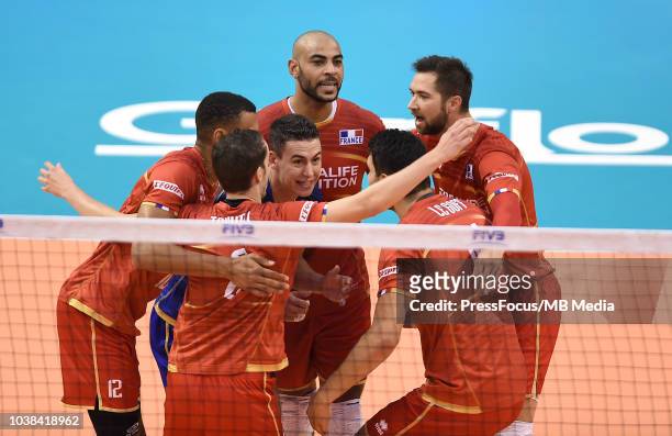 Earvin Ngapeth, Jenia Grebennikov and Kevin Tillie of France celebrate after a point during FIVB World Championships match between France and...