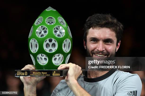 France's Gilles Simon poses with his trophy after winning the ATP Moselle Open final tennis match on September 23, 2018 in Metz, eastern France.