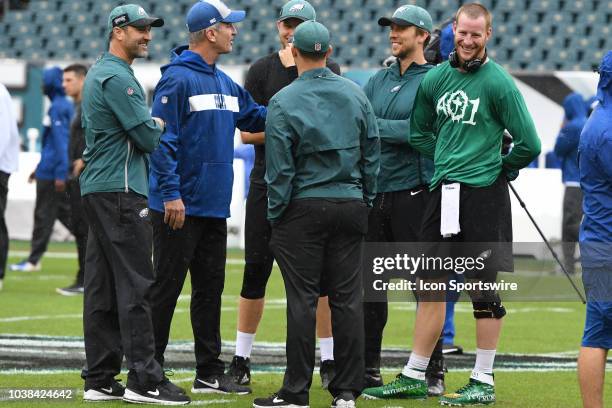 Philadelphia Eagles coach Mike Groh and Indianapolis head coach Frank Reich chat with Eagles quarterbacks during the game between the Indianapolis...