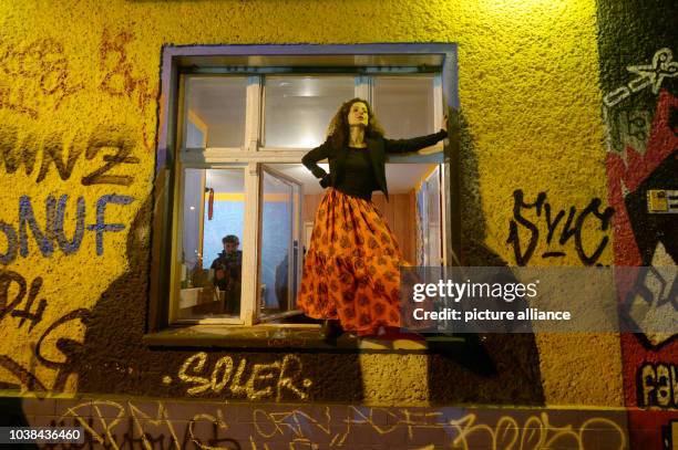Barbara Bendrina sings at the window of a restaurant in the ground floor of a building in Berlin-Friedrichshain, Germany, 02 November 2013. 38...