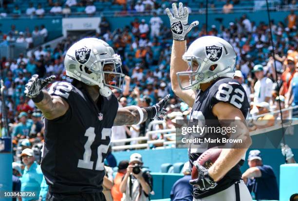 Jordy Nelson of the Oakland Raiders celebrates with Martavis Bryant after scoring a touchdown during the first quarter against the Miami Dolphins at...