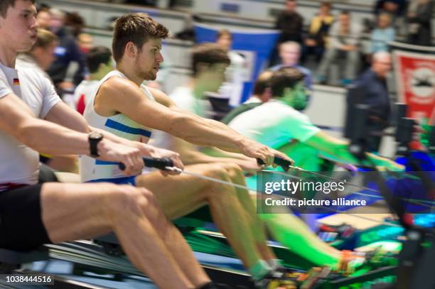 Bastian Faralisch of the Frankfurter Rudergesellschaft Germania rowing club in action on an ergometer during the 2,000-metre race in the domed hall...