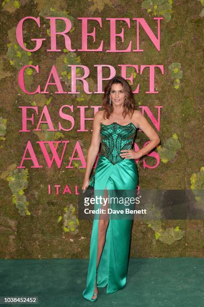 Cindy Crawford, wearing Versace, attends The Green Carpet Fashion Awards Italia 2018 at Teatro Alla Scala on September 23, 2018 in Milan, Italy.