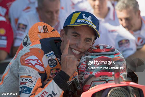 Marc Marquez of Spain and Repsol Honda Team celebrates the victory under the podium at the end of the MotoGP race during the MotoGP of Aragon - Race...