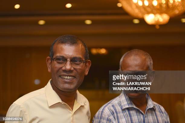 Former President of the Maldives Mohamed Nasheed smiles at a hotel in Colombo on September 23, 2018 as his candidate Ibrahim Mohamed Solih was set to...