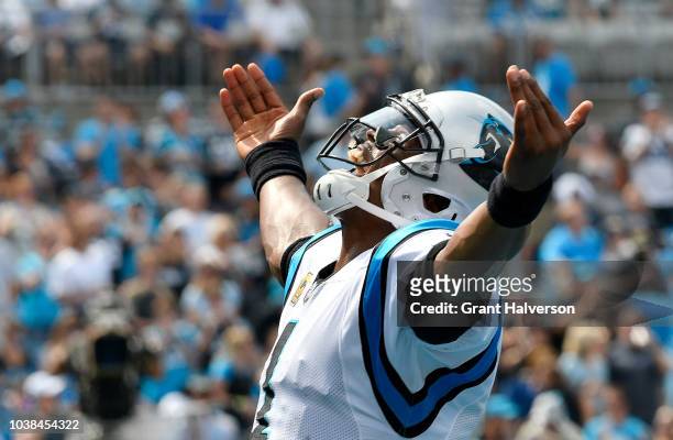 Cam Newton of the Carolina Panthers celebrates a touchdown against the Cincinnati Bengals in the second quarter during their game at Bank of America...