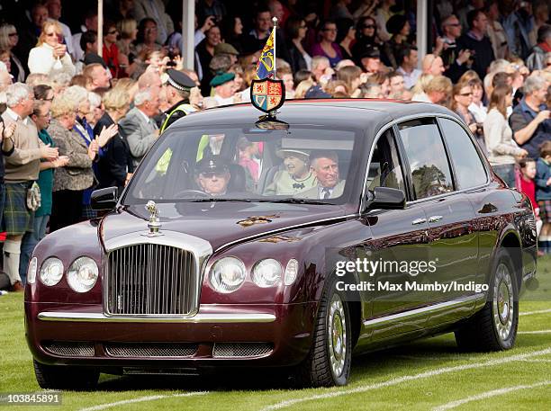 Queen Elizabeth II and Prince Charles, The Prince of Wales arrive, in The Queen's Bentley car, at the Braemar Highland Games at The Princess Royal...