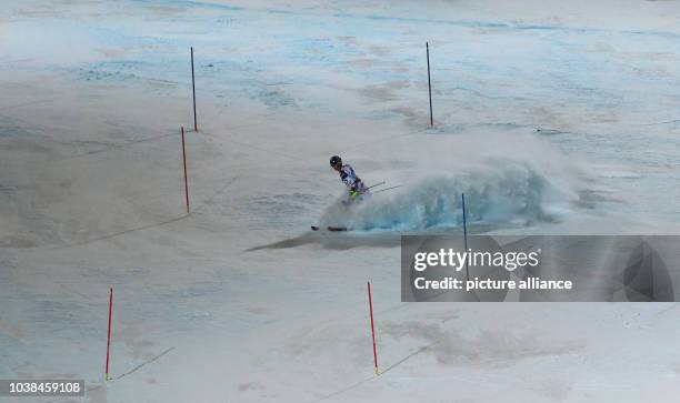 Benjamin Raich of Austria slides down after he droped out during the second run of the men's super combined-downhill at the Alpine Skiing World...