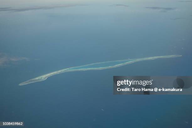 barque canada reef in sparkly islands on south china sea daytime aerial view from airplane - south china sea stock pictures, royalty-free photos & images