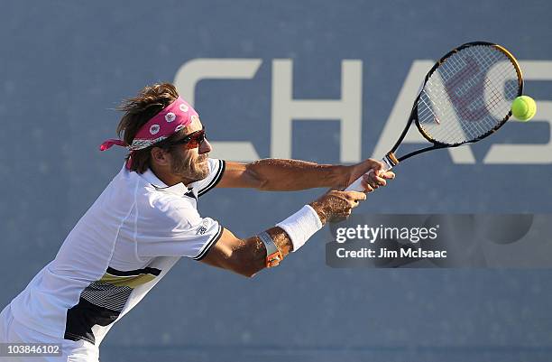 Arnaud Clement of France returns a shot against Mardy Fish of the United States during his men's singles match on day six of the 2010 U.S. Open at...