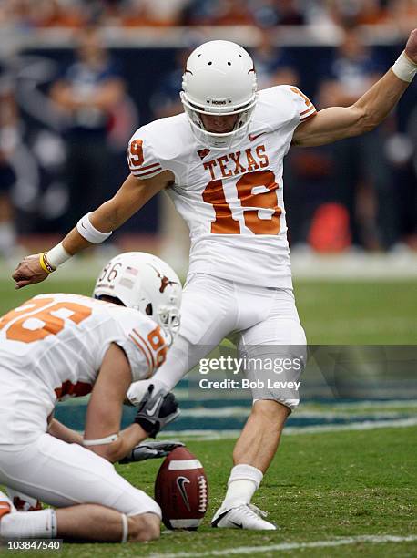 Kicker Justin Tucker of the Texas Longhorns kicks a field goal out of the hold of Cade McCrary at Reliant Stadium on September 4, 2010 in Houston,...