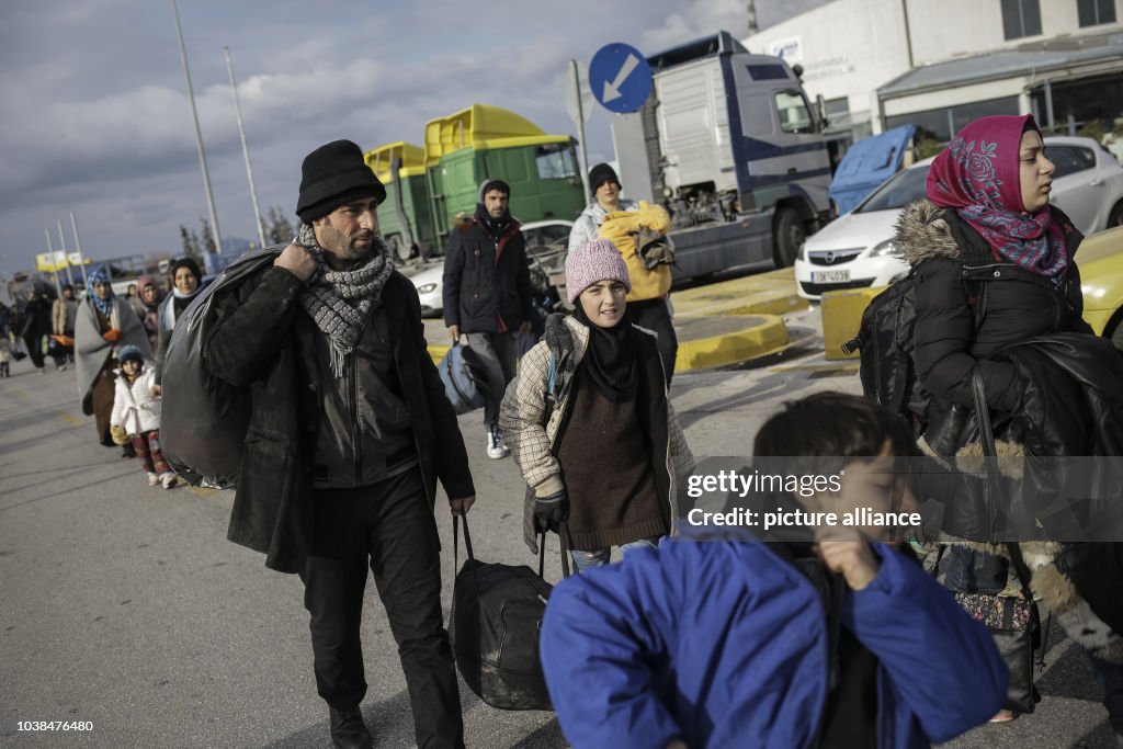 Refugees and migrants arrive at Piraeus port