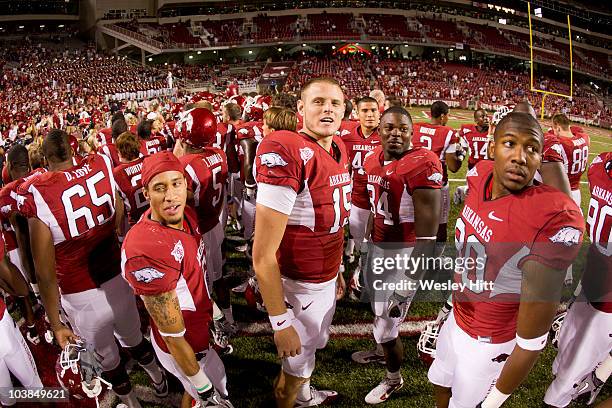 Quarterback Ryan Mallett and teammates of the Arkansas Razorbacks watch a replay on the scoreboard after a game against the Tennessee Tech Golden...