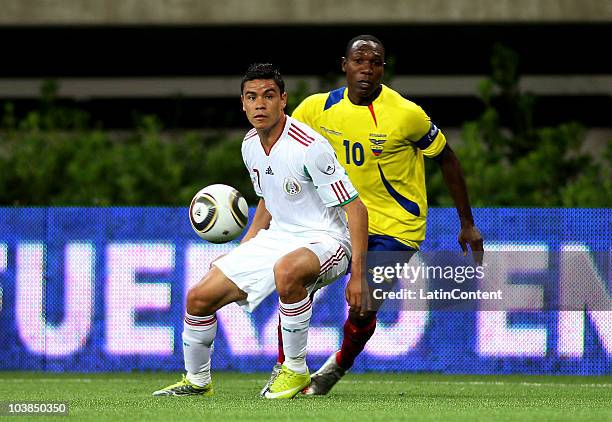 Pablo Barrera of Mexico struggles for the ball with Walter Ayovi of Ecuador during an International Friendly Match at Omnilife stadium on September...