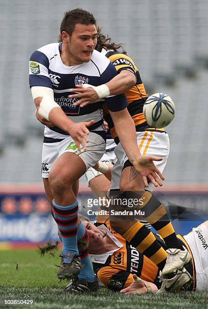 Angus Ta'avao of Auckland off loads the ball during the round six ITM Cup match between Auckland and Taranaki at Eden Park on September 5, 2010 in...