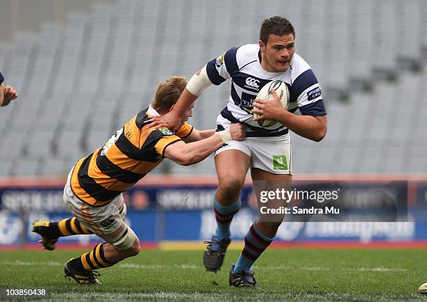 Angus Ta'avao of Auckland fends off Ben Souness of Taranako during the round six ITM Cup match between Auckland and Taranaki at Eden Park on...
