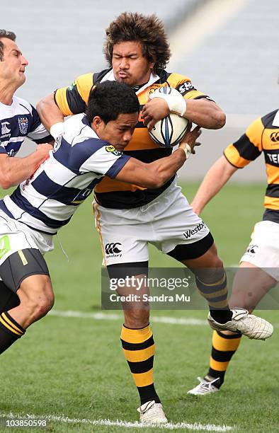 Isaia Tuifua of Taranaki is tackled by Atieli Pakalani of Auckland during the round six ITM Cup match between Auckland and Taranaki at Eden Park on...