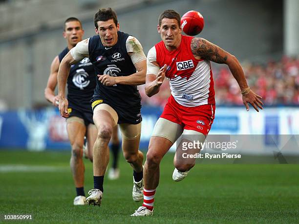Jesse White of the Swan competes for the ball against Michael Jamison of the Blues during the AFL First Elimination Final match between the Sydney...