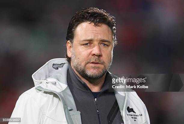 Russell Crowe watches on during the warm-up before the round 26 NRL match between the St George Illawarra Dragons and the South Sydney Rabbitohs at...