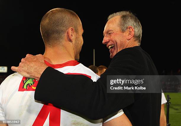 Dragons coach Wayne Bennett shares a laugh with Matt Cooper of the Dragons after the round 26 NRL match between the St George Illawarra Dragons and...