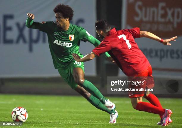 Caiuby of FC Augsburg and Emre Nefiz of Gaziantepspor challenge for the ball during a test game in Belek, Turkey, 15 January 2015. German teams stay...
