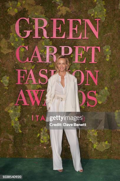 Amber Valletta, wearing Agnona, attends The Green Carpet Fashion Awards Italia 2018 at Teatro Alla Scala on September 23, 2018 in Milan, Italy.