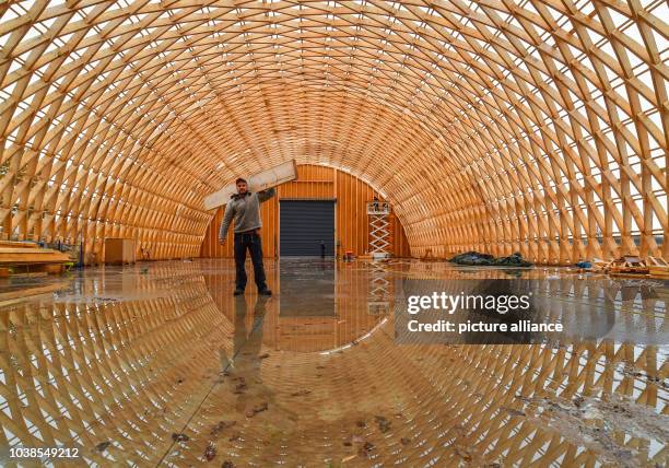 Carpenter Master Eric Bensemann of the company Elite Holzbau standing in his carcass of a production hall made of spruce wood in the industrial park...