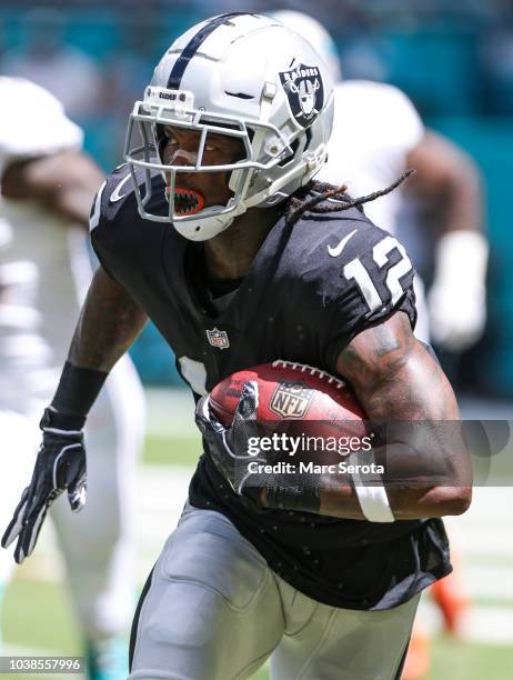 Martavis Bryant of the Oakland Raiders runs for yardage during the first quarter against the Miami Dolphins at Hard Rock Stadium on September 23,...