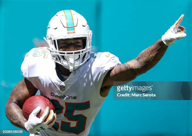 Xavien Howard of the Miami Dolphins grabs the interception during the first quarter against the Oakland Raiders at Hard Rock Stadium on September 23,...