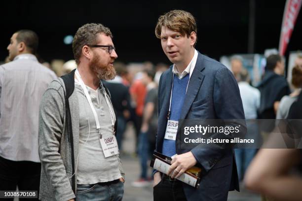 Chief editor of the German newspaper Bild Kai Diekmann and Xing founder Lars Hinrichs chat at the TechCrunch Disrupt technology conference in Berlin,...