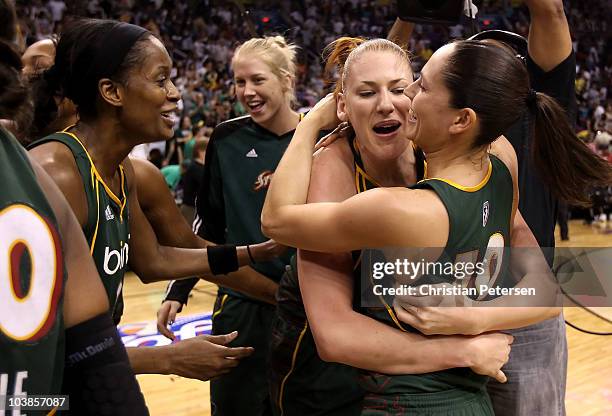 Swin Cash, Lauren Jackson and Sue Bird of the Seattle Storm celebrate after defeating the Phoenix Mercury in Game Two of the Western Conference...