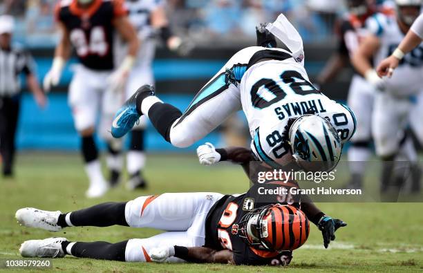 Ian Thomas of the Carolina Panthers runs the ball against Shawn Williams of the Cincinnati Bengals in the second quarter during their game at Bank of...