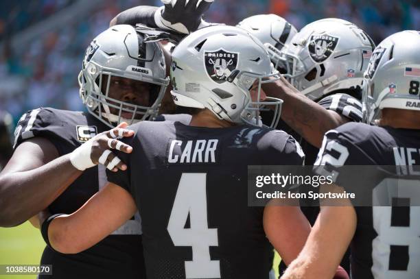 Oakland Raiders Quarterback Derek Carr , Oakland Raiders Center Rodney Hudson and Oakland Raiders Wide Receiver Martavis Bryant celebrates Oakland...