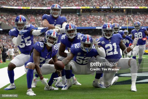New York Giants defense celebrates an interception by Alec Ogletree of the New York Giants in the fourth quarter at NRG Stadium on September 23, 2018...